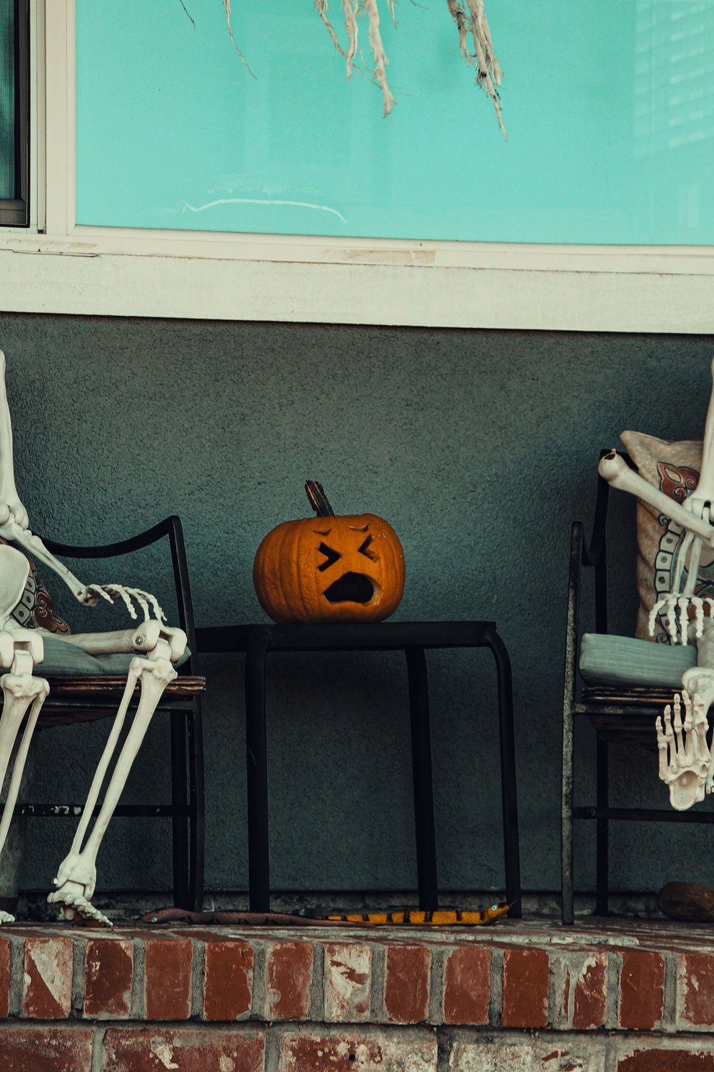 13. Skeleton Couple Seated Props for Instant Atmosphere - halloween party decorationst
