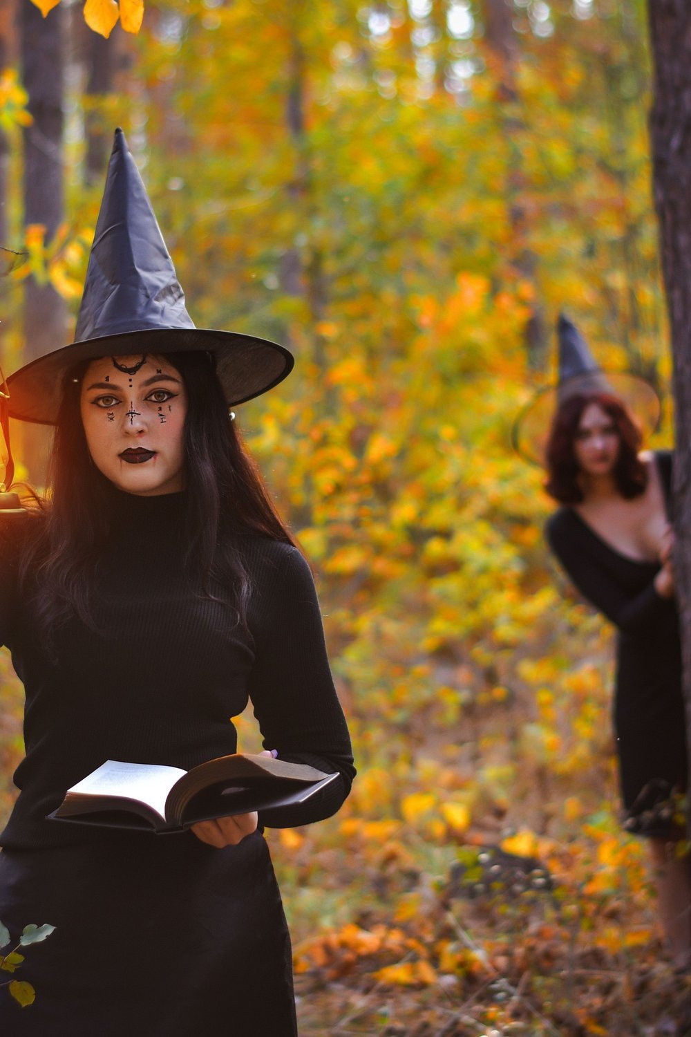 15. Spellbook and Witch Hat Bookshelf Styling - halloween party decorationst