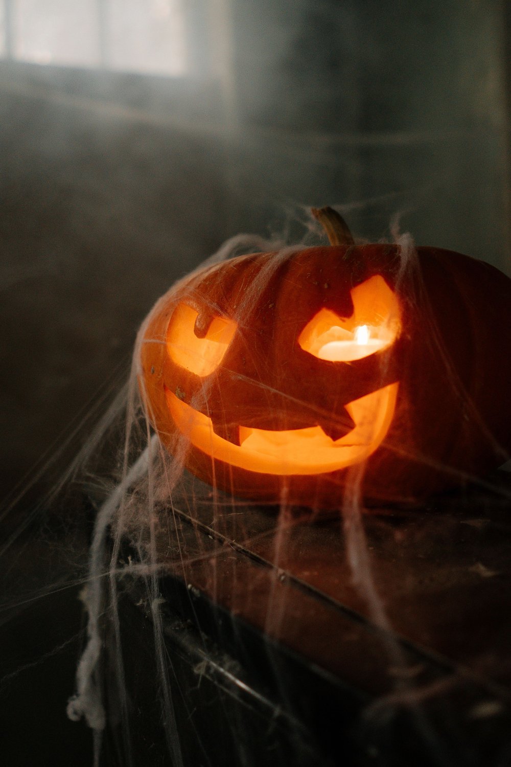 6. Glow-in-the-Dark Cobweb Corner Installations - halloween party decorationst