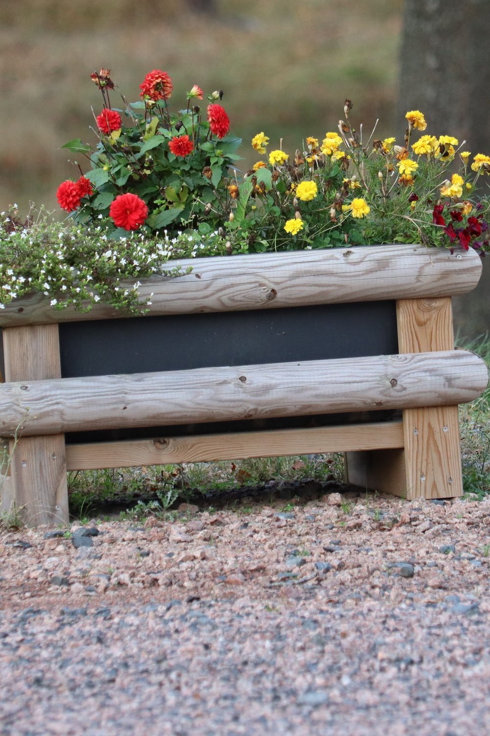 9. Fairy Garden in a Raised Wooden Planter Box - outdoor fairy garden diy